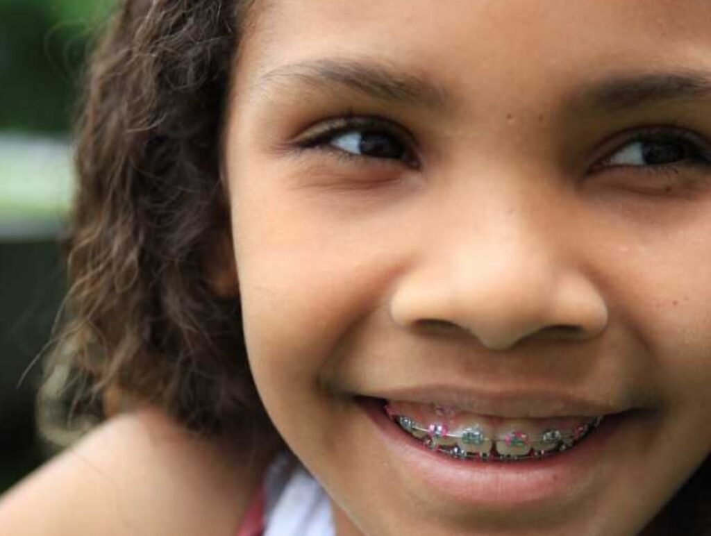 young girl with colorful braces