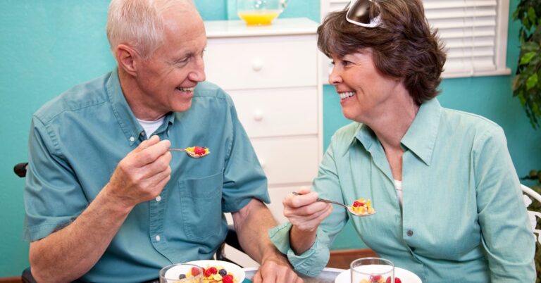 senior couple enjoys breakfast together and discusses Is 70 too old for braces