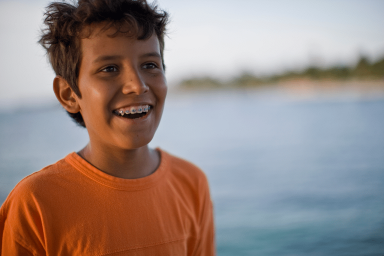 Young patient with braces correcting a bite problem at Premiere Orthodontics in Orlando