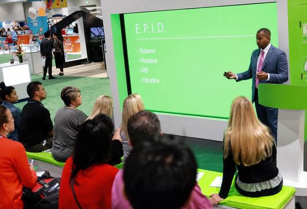 Dr. Battle presenting clear aligner therapy at an international orthodontic conference.